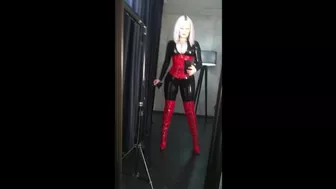 Black latex rubber catsuit and red fetish corset with thigh high boots, selfie video