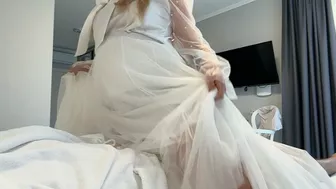 Wedding night at the hotel and a white wedding dress with a pregnant bride